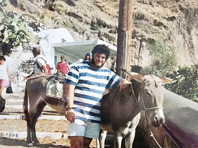 Image of Jeannette Kufferman's son, Elias, on holiday standing by a donkey